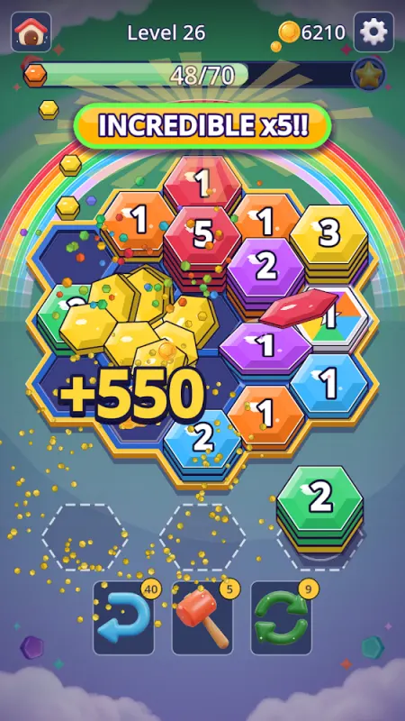 Hexa Pop level with stacks of colored hexagons and a +550 bonus